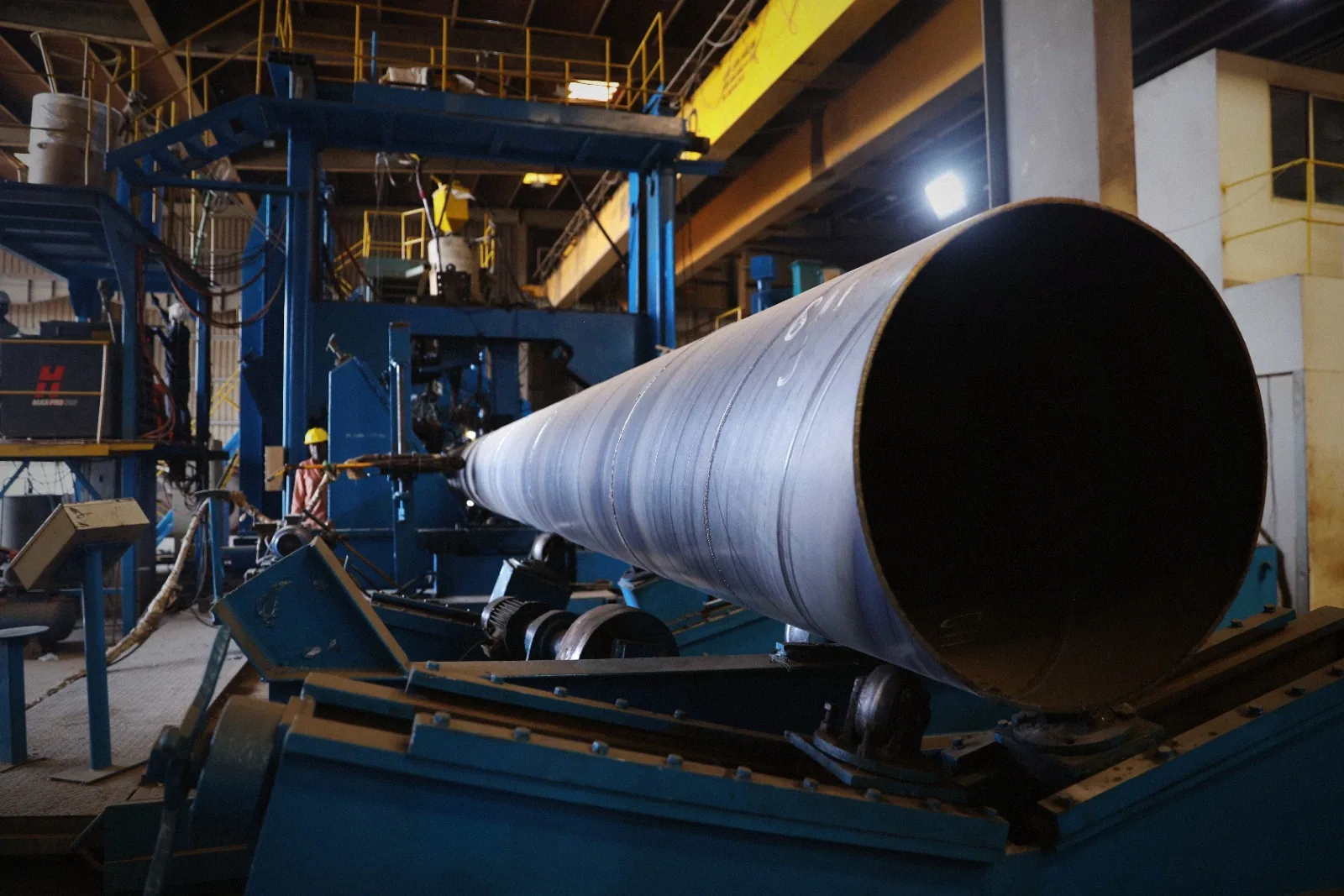 Spiral steel pipe being formed